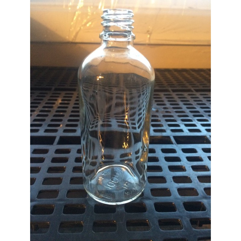 100 ml clear glass bottle.